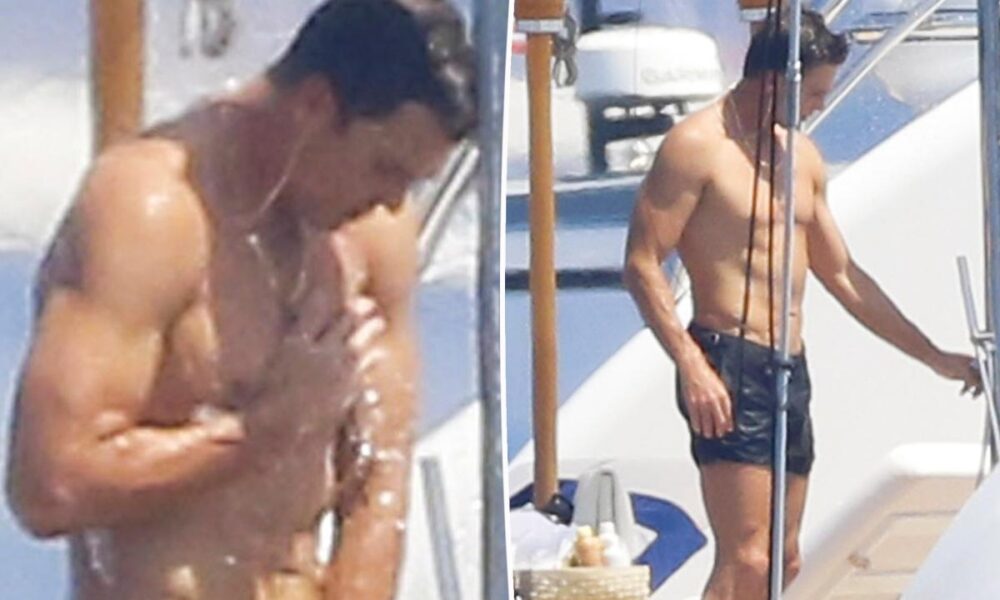 Tom Brady caught with his hand down his swimsuit during steamy yacht shower in France