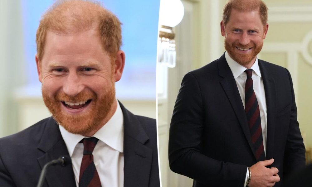Prince Harry is all smiles as he breaks cover on same day he announces UK return
