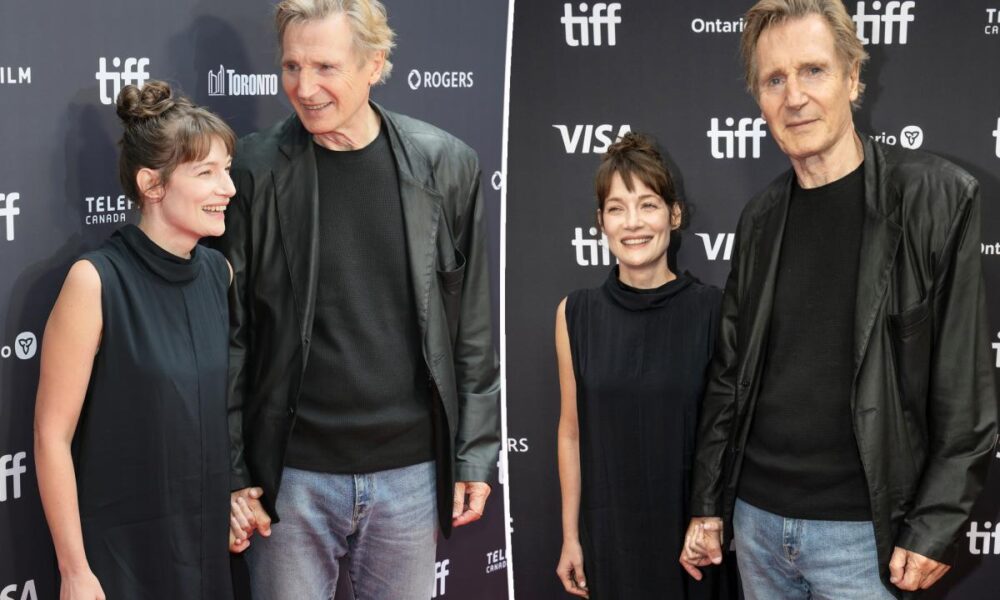 Liam Neeson, 74, holds hands with Stella Stocker on Toronto International Film Festival red carpet