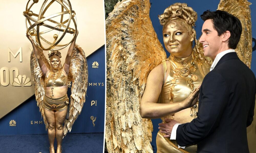 Meg Stalter dressed as an Emmy statue on Emmys 2026 red carpet