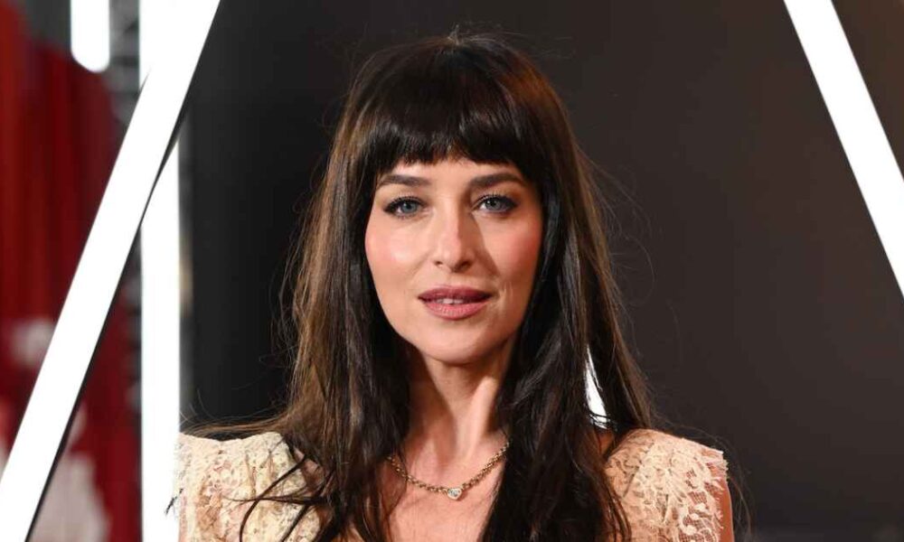 Dakota Johnson Shows Glimpse of Black Lingerie in Sheer Lace Dress at ‘Verity’ London Premiere