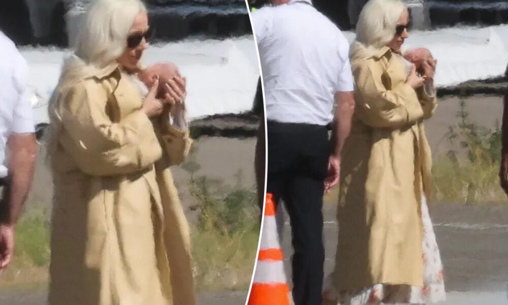 Glam Lady Gaga cradles her baby as she touches down in LA with fiancé Michael Polansky