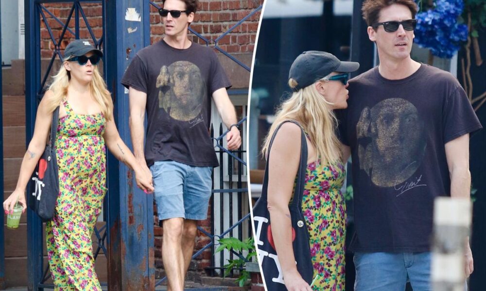 Busy Philipps holds hands with comedian Jason Selvig after revealing malignant brain tumor