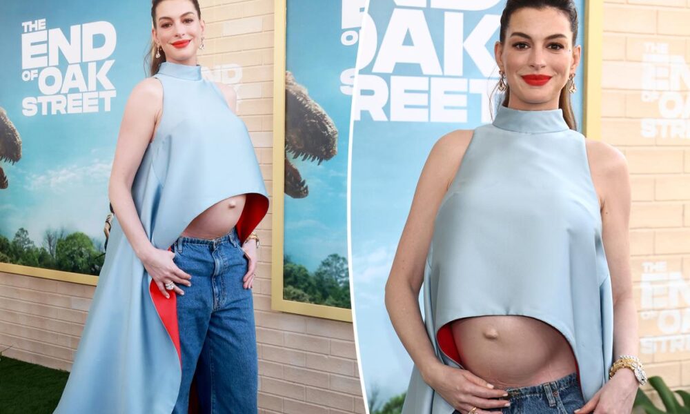 Pregnant Anne Hathaway bares baby bump in cropped cape at ‘The End of Oak Street’ premiere