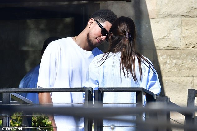 Leaning in: Booker leaned in close to Kendall during their chat as they whispered to each other