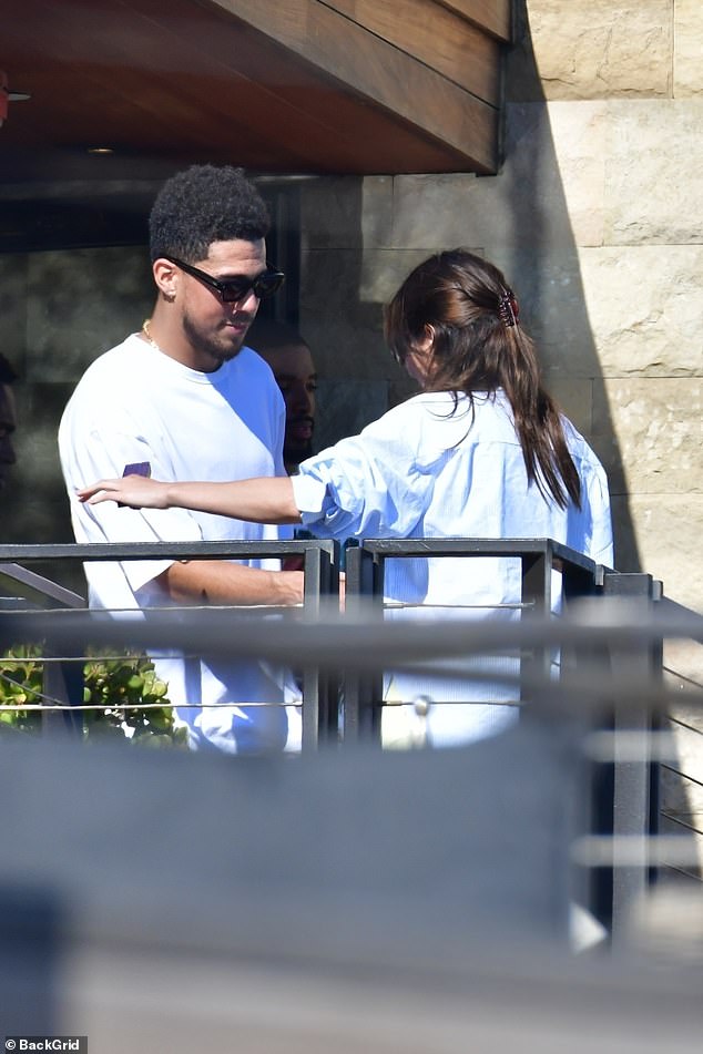 Flirty: The chemistry between Jenner and Michigan native was palpable to onlookers as the Keeping Up With The Kardashians gazed at him with a coy smile across her face