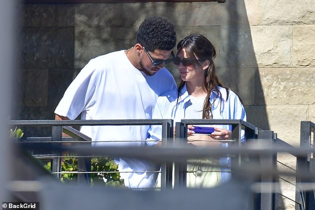 For Kendall's ears only: Booker spoke softly as he made his on-again, off-again girlfriend chuckle