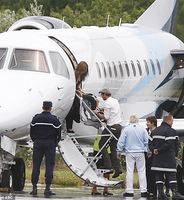 The former couple are pictured at Brie-Champniers airport in France as they board a private jet with their kids in 2007, the year before they bought the Miraval property. Jolie's claims Pitt flew into a rage, grabbing her by the head, shaking her, and shoving her into a bathroom wall before punching the ceiling numerous times while on a private jet