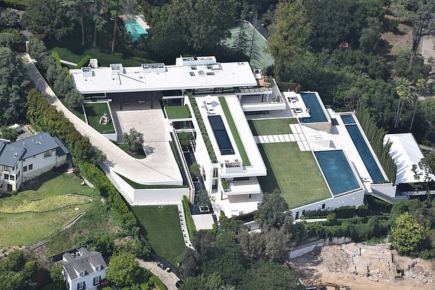 The Bel Air home features eight bedrooms, 11 bathrooms and four outdoor swimming pools