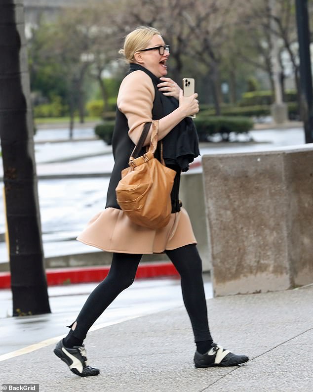 Something appeared to have tickled Evans as she laughed to herself while walking into court