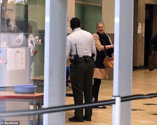 Evans chatted for a moment with some of the security staff inside the courthouse