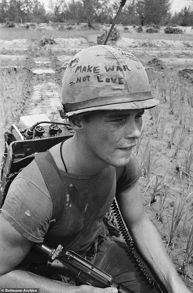 The clue here IS the picture itself. Know the picture and you'll know the album. The soldier was a -year-old US Marine Corporal Michael Wynn, from Marion, Ohio. He was serving in South Vietnam, in Da Nang, when the image was snapped on September 21, 1967 in Da Nang (pictured)