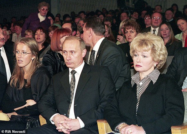 She has had long links with Russian despot Vladimir Putin, who is reportedly her godfather. Ksenia Sobchak (pictured left) with Putin, Sobchak's mother Liudmila Narusova, right
