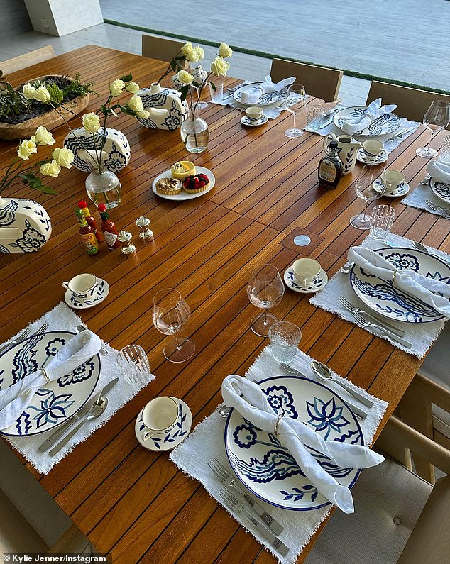 Dinner date: One of the makeup line founder's photos included an image of an elegantly set table