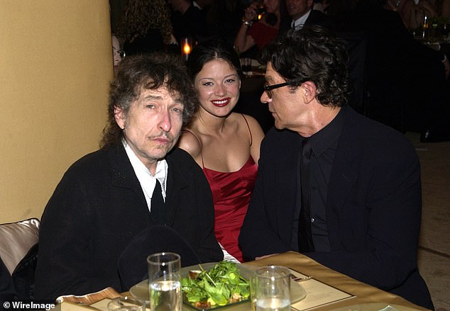 The late musician's kids claim she was taking advantage of him in his waning years, unbeknownst to them, old friends like Dylan, and the guitarist's ex-wife Dominique Bourgeois. The trio are seen together in 2022