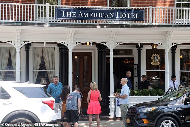 The singer, second from right in black cap, told the press to 'Judge not lest ye be judged' when it comes to the Timberlake arrest
