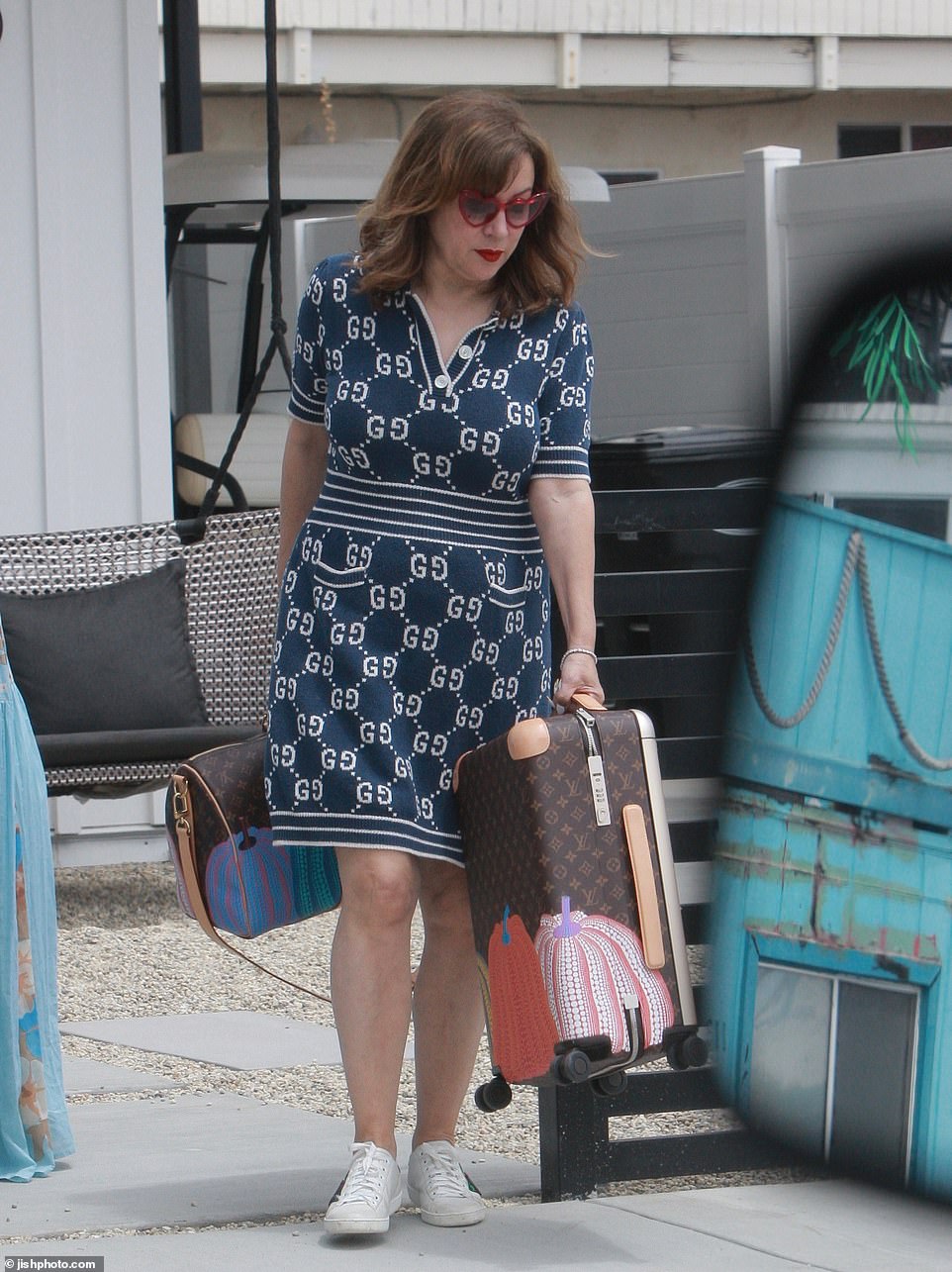 Jennifer Tilly could be seen with expensive Louis Vuitton Yaykoi Kusama editon luggage that she left out on the street for the driver to load into the black SUV