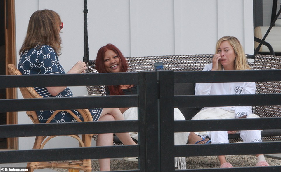 Jennifer Tilly, 65, could seen showing photos from her phone to Garcelle, with Sutton, 52, interrupting saying, 'Oh no, I hate that picture, don't! I mean, I had just gotten off the flight I was so bloated I was retaining water, I mean I think I weighed 137 and I weigh 112 now.'