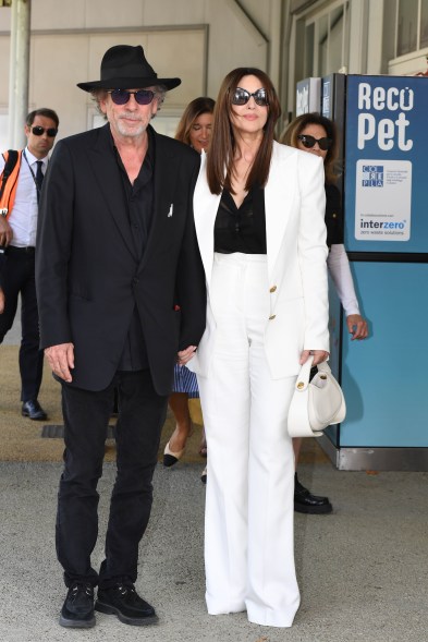 Monica Bellucci (wearing Balmain) and Tim Burton during the Venice Film Festival 2024.